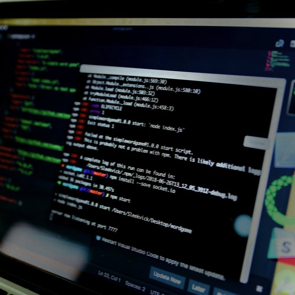 A laptop screen showing a code editor and terminal